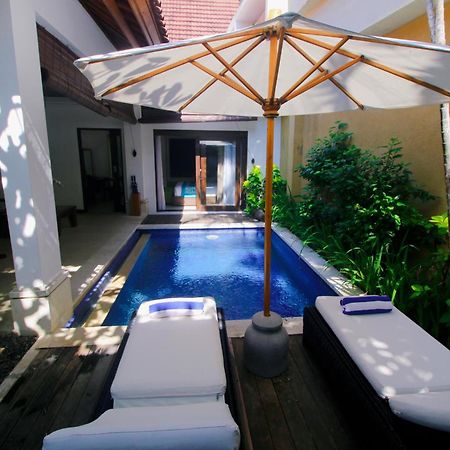 Sagara Villas And Suites Sanur By Ahm Exterior foto A pool at a resort in Phuket, Thailand