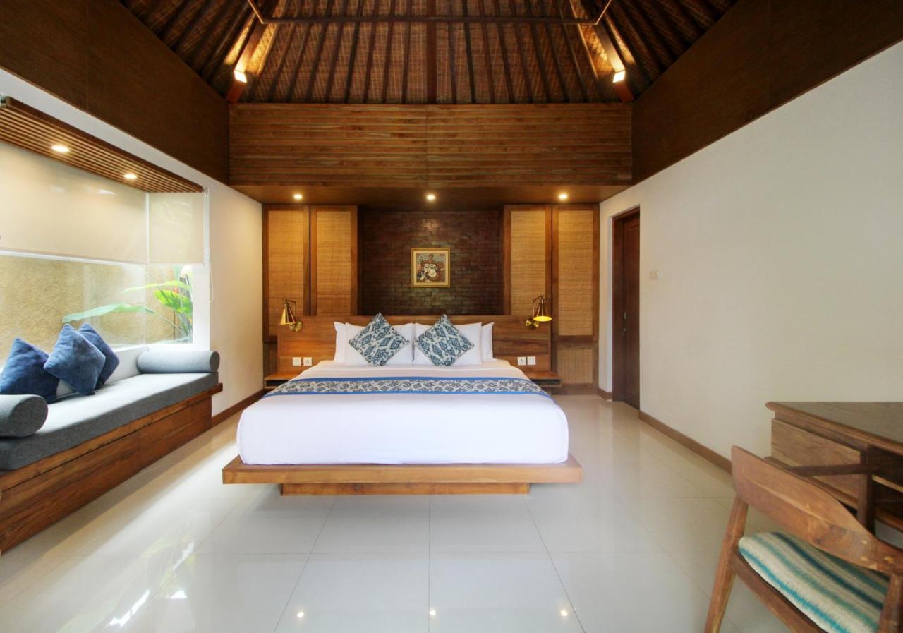 Sagara Villas And Suites Sanur By Ahm Exterior foto A bedroom in a villa